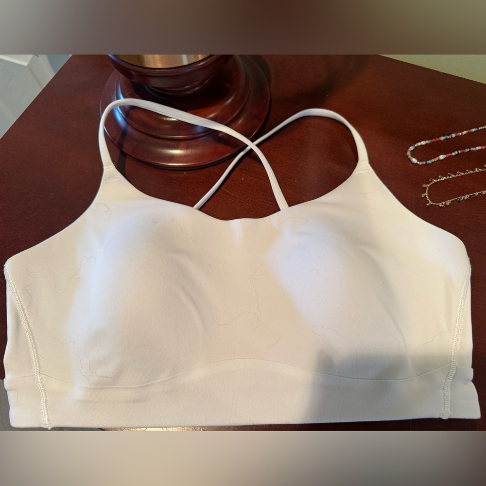 CALIA by Carrie Underwood White sports bra w/ medium support and straps back.